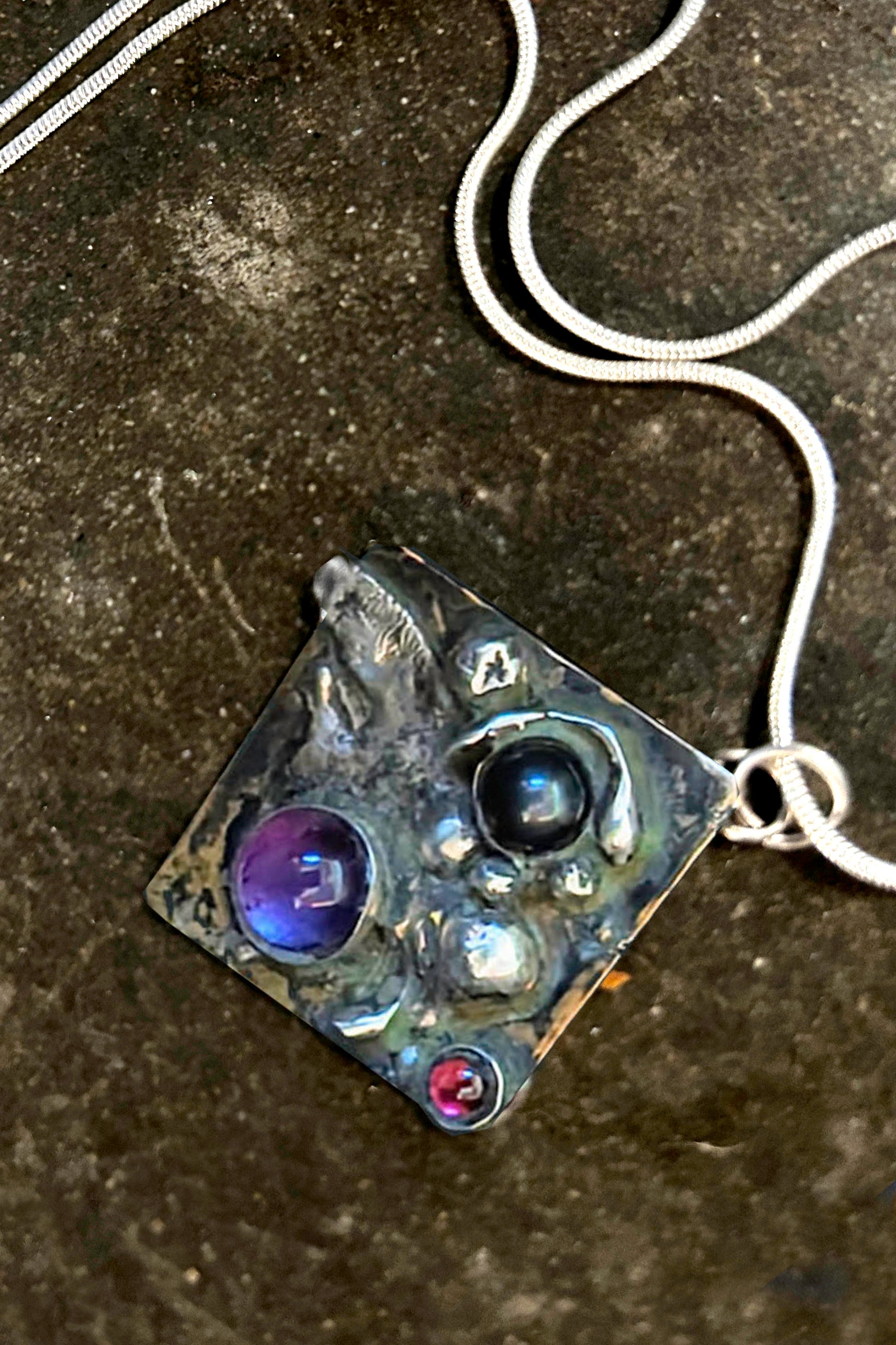 Handmade mens silver and mixed metal. Amethyst. Garnet. Onyx  on neck Goth amulets. Hip hop pendants. Boho  mens pendant on stone